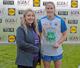Waterford's Emma Murray receives her Player of the Match award from Jackie Skehan, store manager LIDL Dungarvan