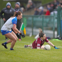 Waterfords Rebecca Casey & Galways Eabha Smith struggle with the wet underfoot conditions